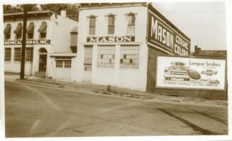 A photograph showing the façade of the Mason Color® factory in the 1950's.